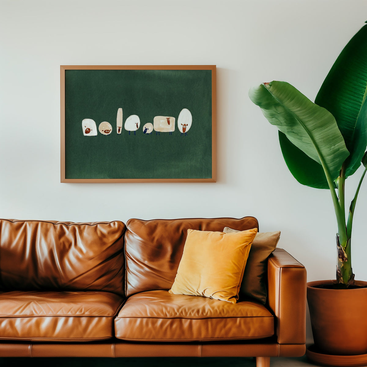Funny sheep wall art print in an oak frame above a cognac leather sofa