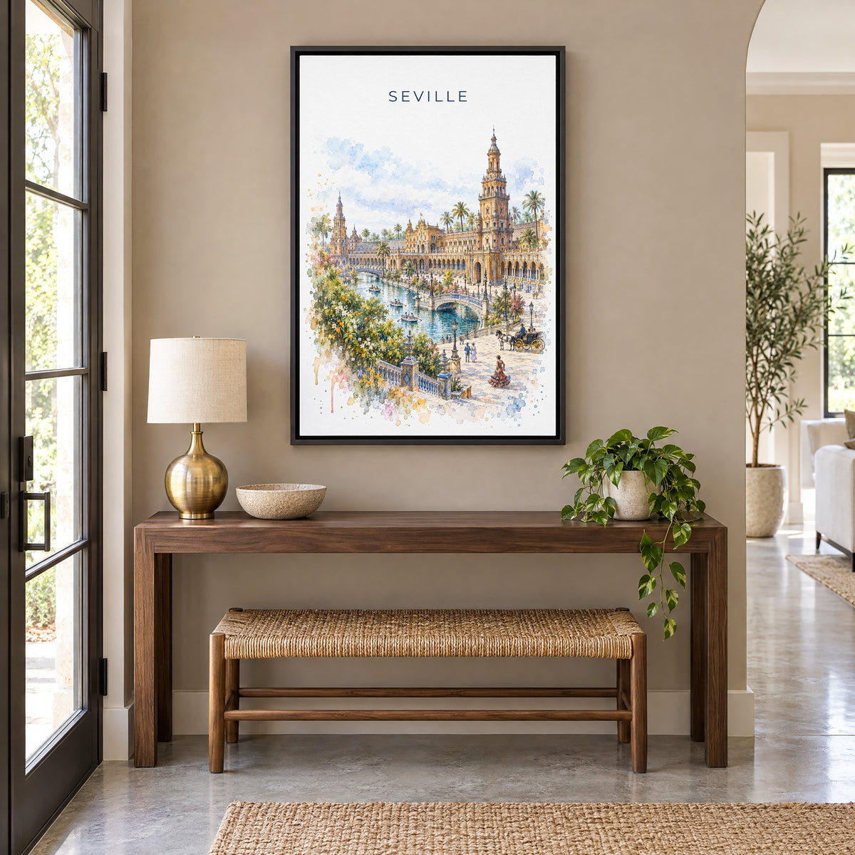 Seville watercolor print as a black floater canvas above a walnut console and woven bench in an entryway