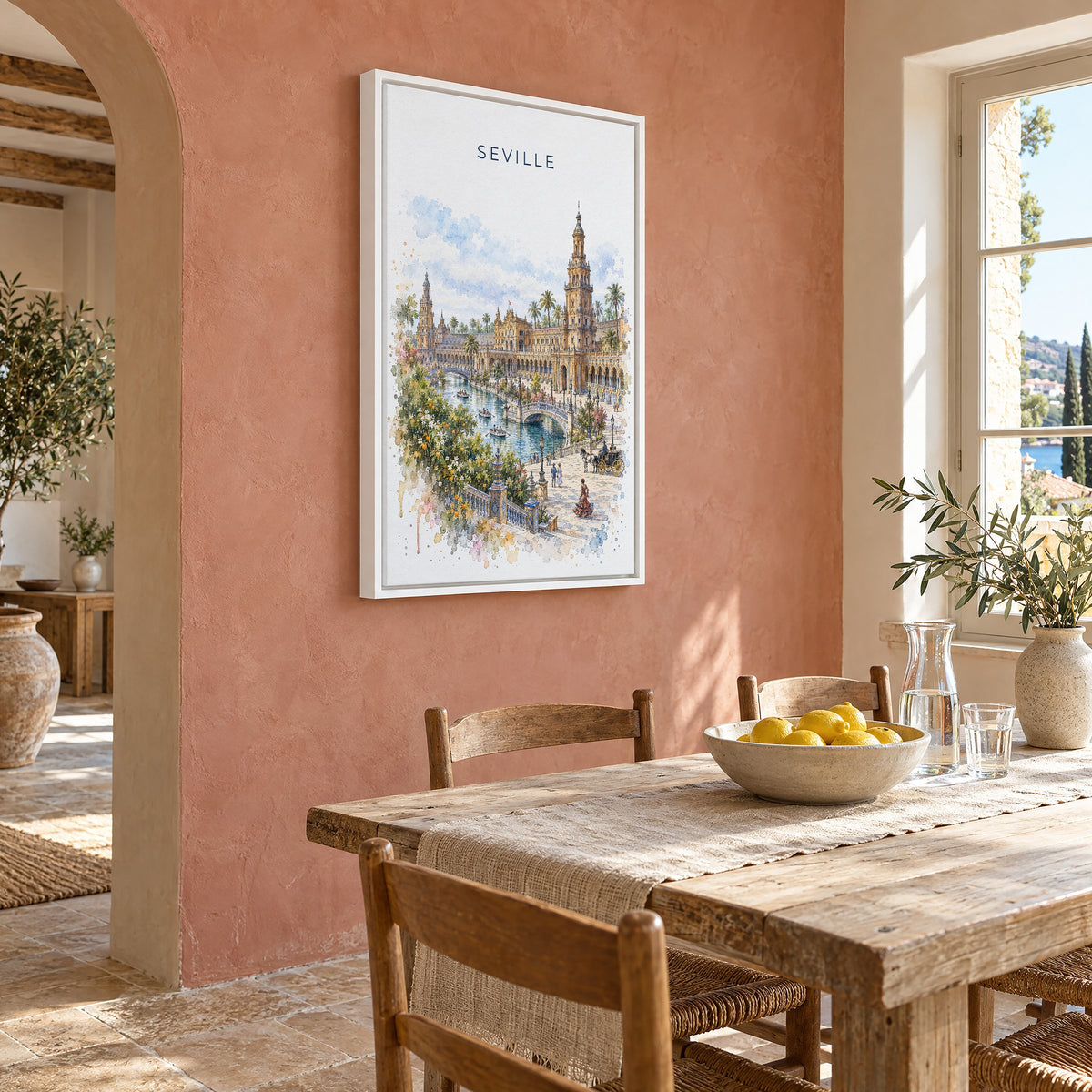 Seville watercolor print as a white floater canvas on a terracotta wall above a rustic dining table