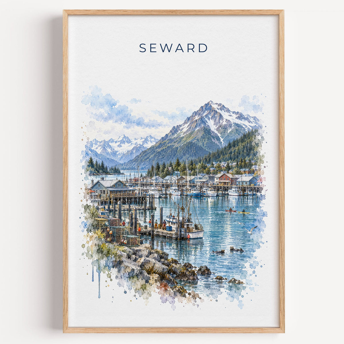 Seward, Alaska watercolor print in a light oak frame on a plain white wall