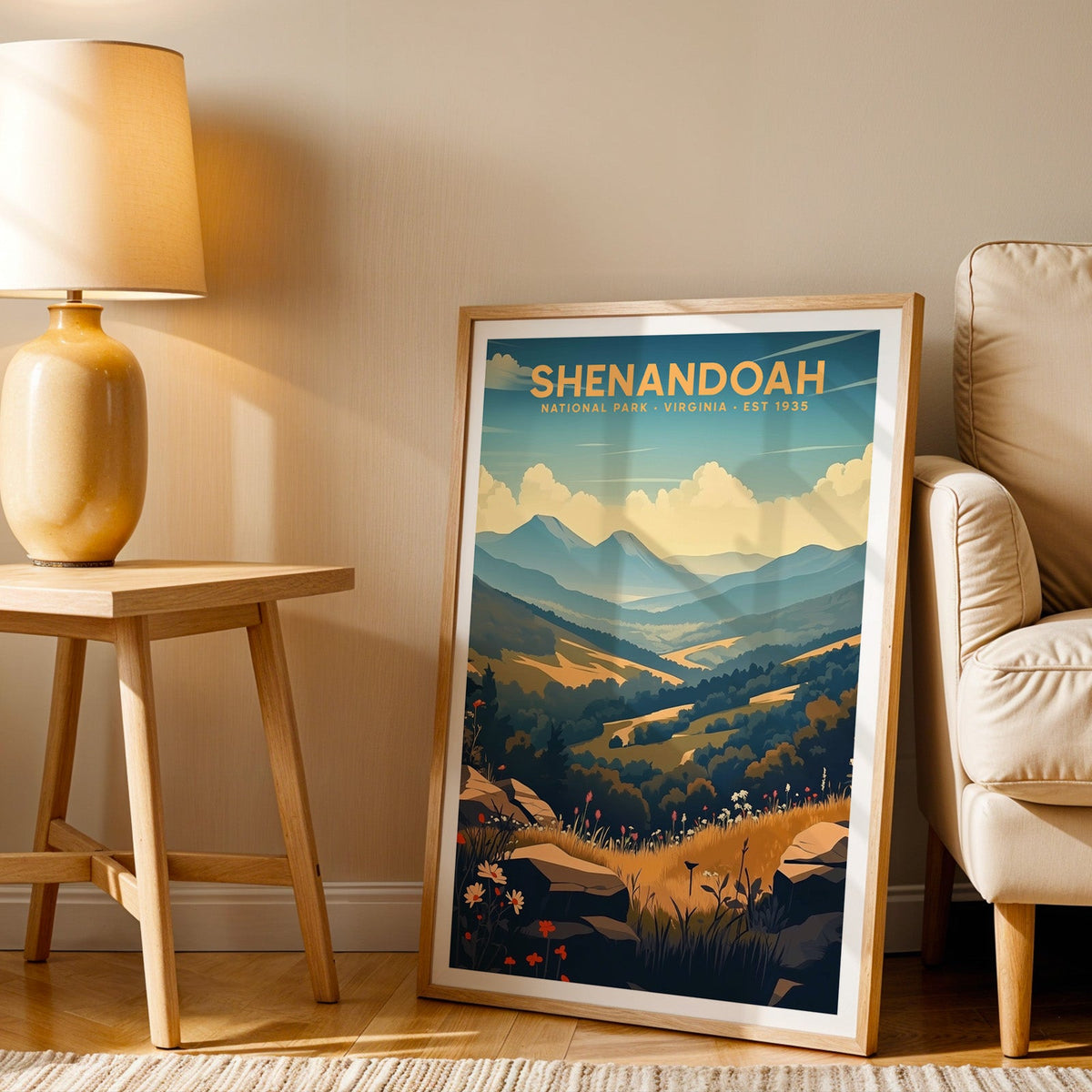 Shenandoah print in an oak frame beside a cream armchair and an amber lamp in warm afternoon light