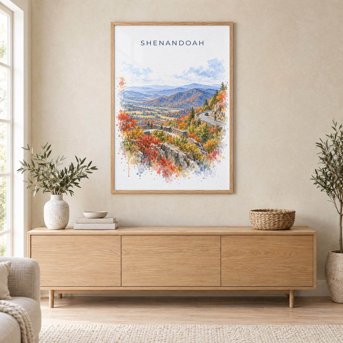 Shenandoah National Park watercolor print in an oak frame above a light wood sideboard in a Scandinavian living room