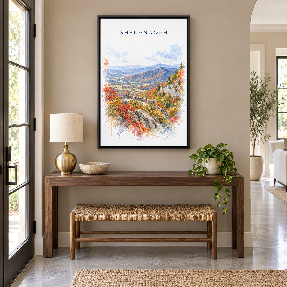 Shenandoah National Park watercolor print as a black floater canvas above a walnut console and woven bench in an entryway