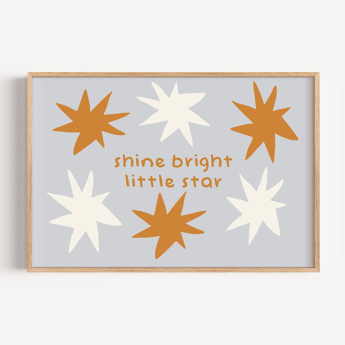 Landscape shine bright little star nursery print in a light oak frame on a plain white wall