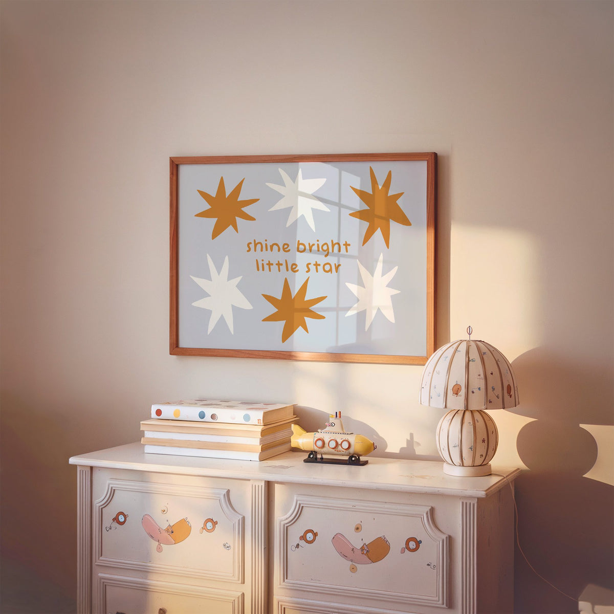 Landscape shine bright little star nursery print in a cherry wood frame above a painted dresser and lamp
