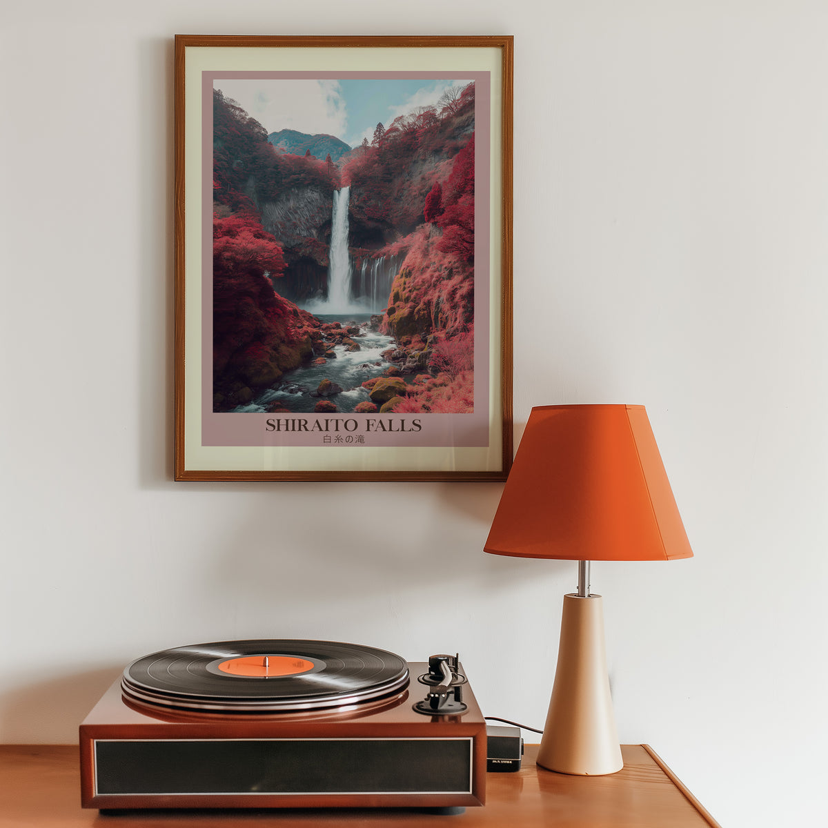 Shiraito Falls in autumn print in a walnut frame above a sideboard with a record player