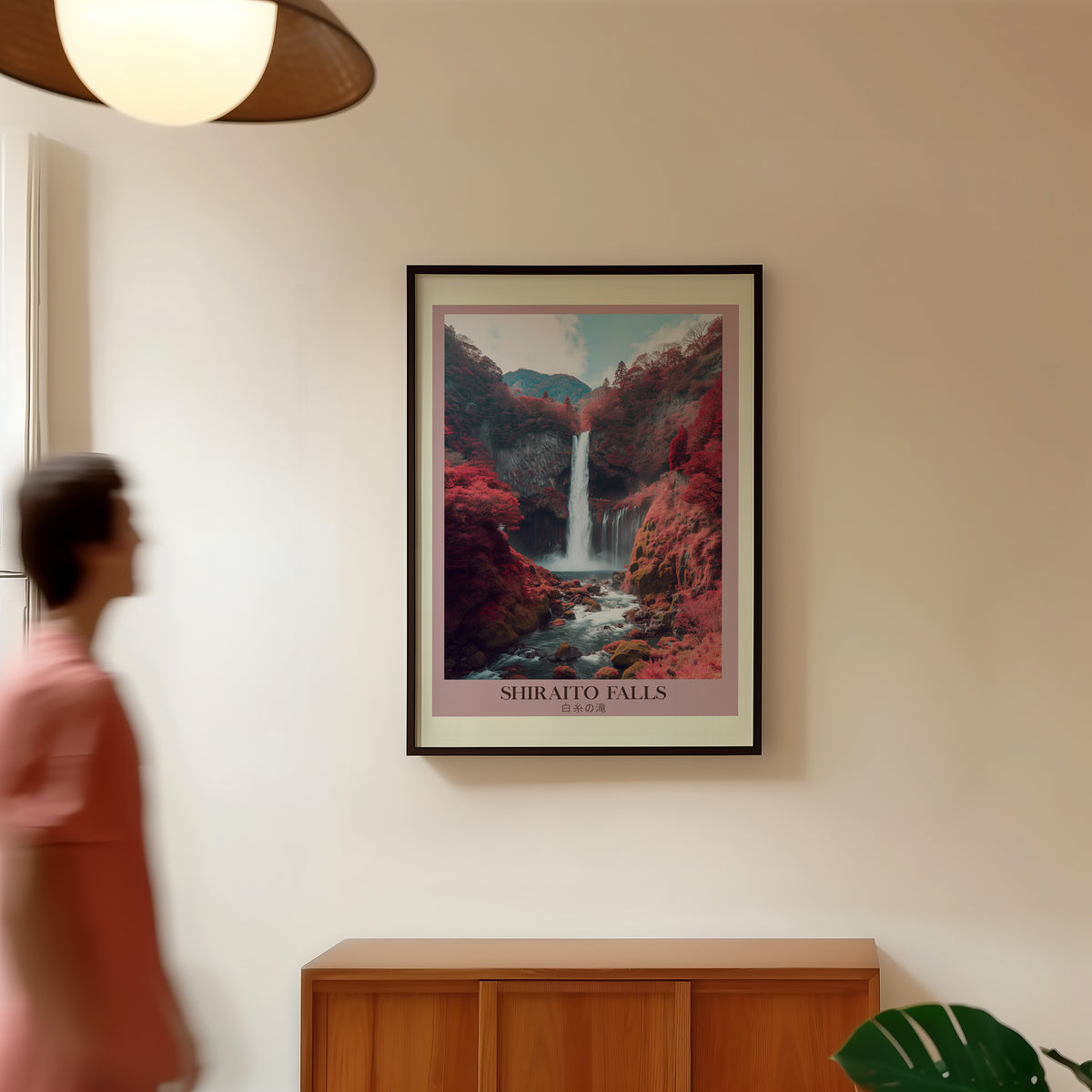 Shiraito Falls in autumn print in a black frame in a hallway under a rattan pendant