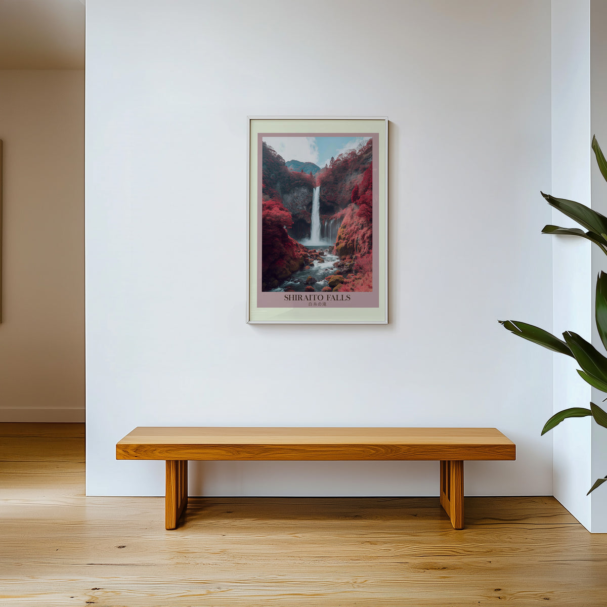 Shiraito Falls in autumn print shown in a white frame above a wooden entryway bench