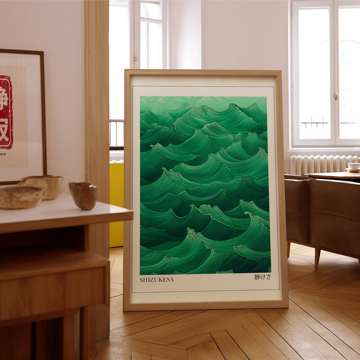 Jade green Shizukesa waves print in an oak frame on the parquet floor of a sunlit living room