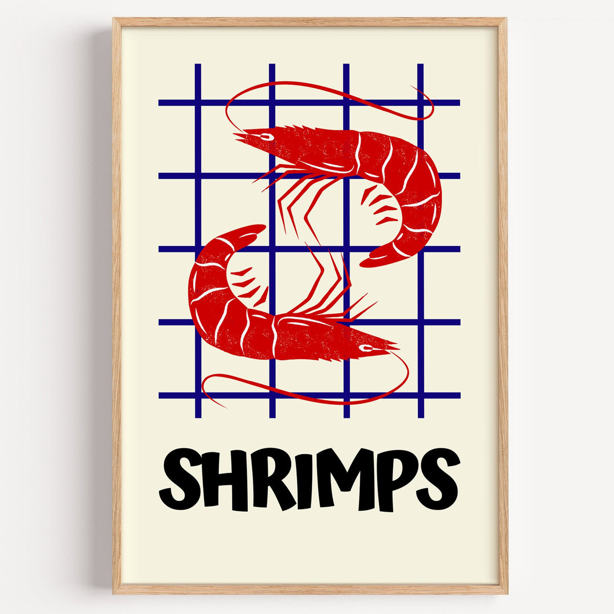 SHRIMPS red and blue grid print in a light oak frame on a plain white wall