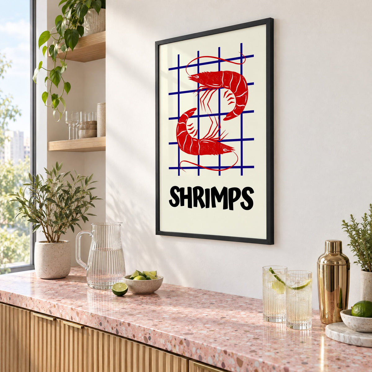 SHRIMPS red and blue grid print in a black frame above a pink terrazzo cocktail counter with limes, seen at an angle