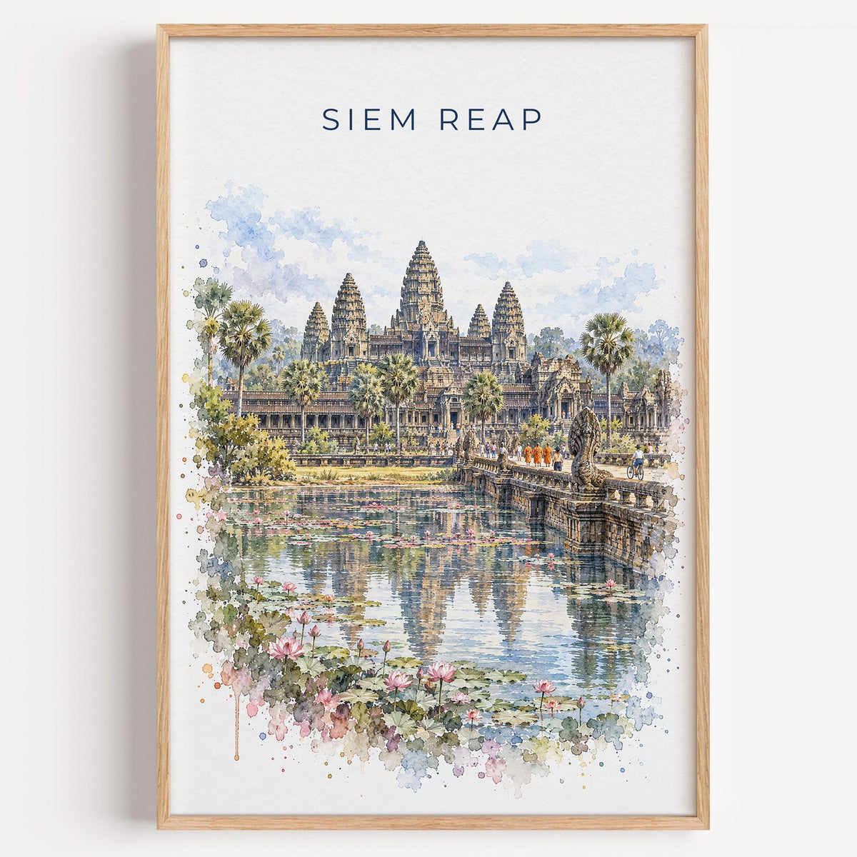 Siem Reap watercolor print in a light oak frame on a plain white wall