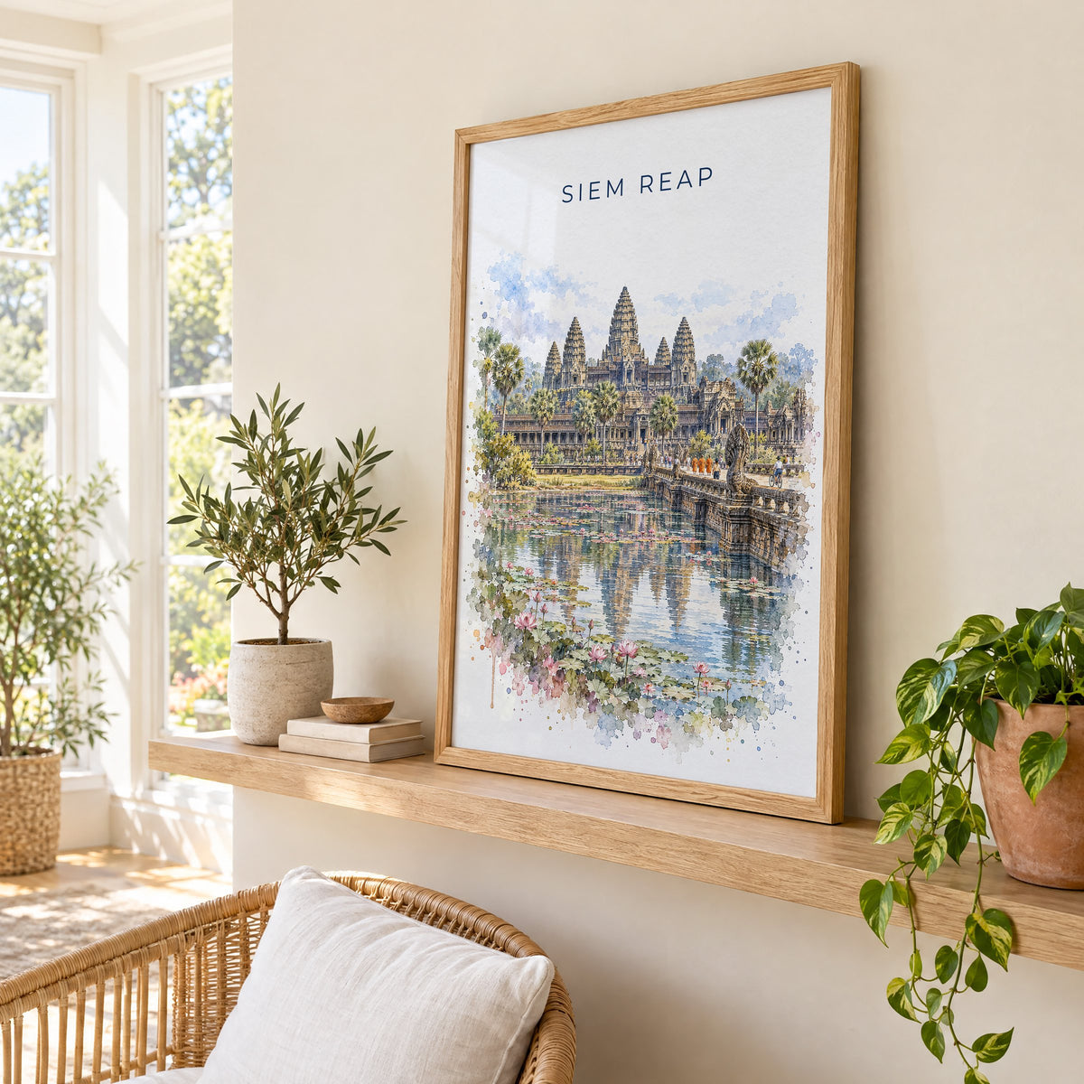 Siem Reap watercolor print in an oak frame on a picture ledge in a sunlit sunroom