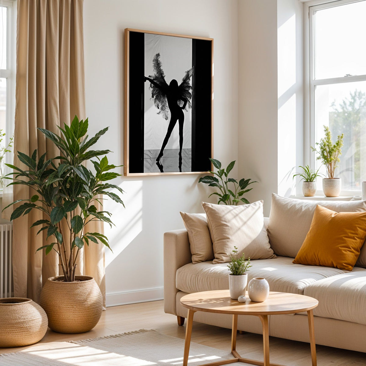 Backlit figure with feather wings in a doorway print in an oak frame above a cream sofa beside woven planters