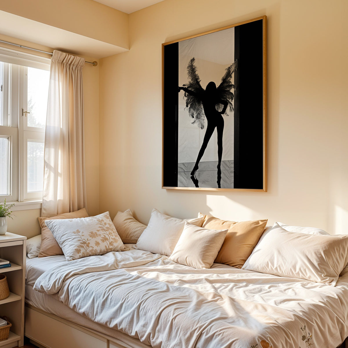 Backlit figure with feather wings in a doorway print in an oak frame above a cream daybed in a sunny bedroom