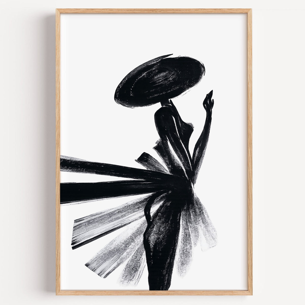 Woman in wide hat with fanned brushstroke skirt print in a light oak frame on a plain white wall