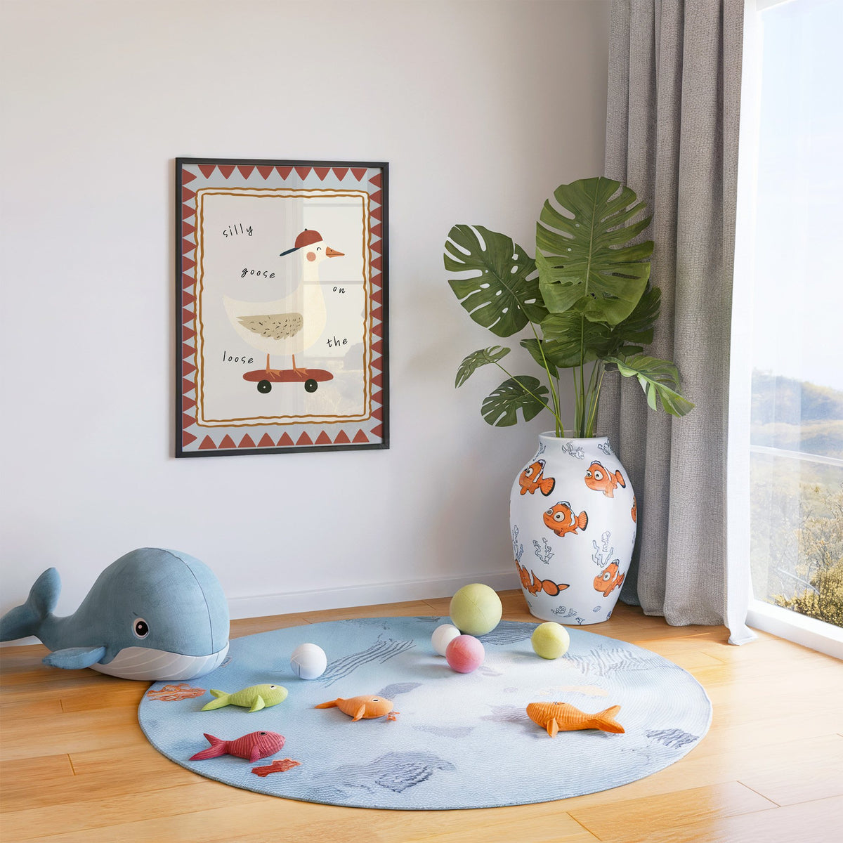 Silly goose on the loose nursery print in a black frame in a playroom with an ocean rug and whale plush
