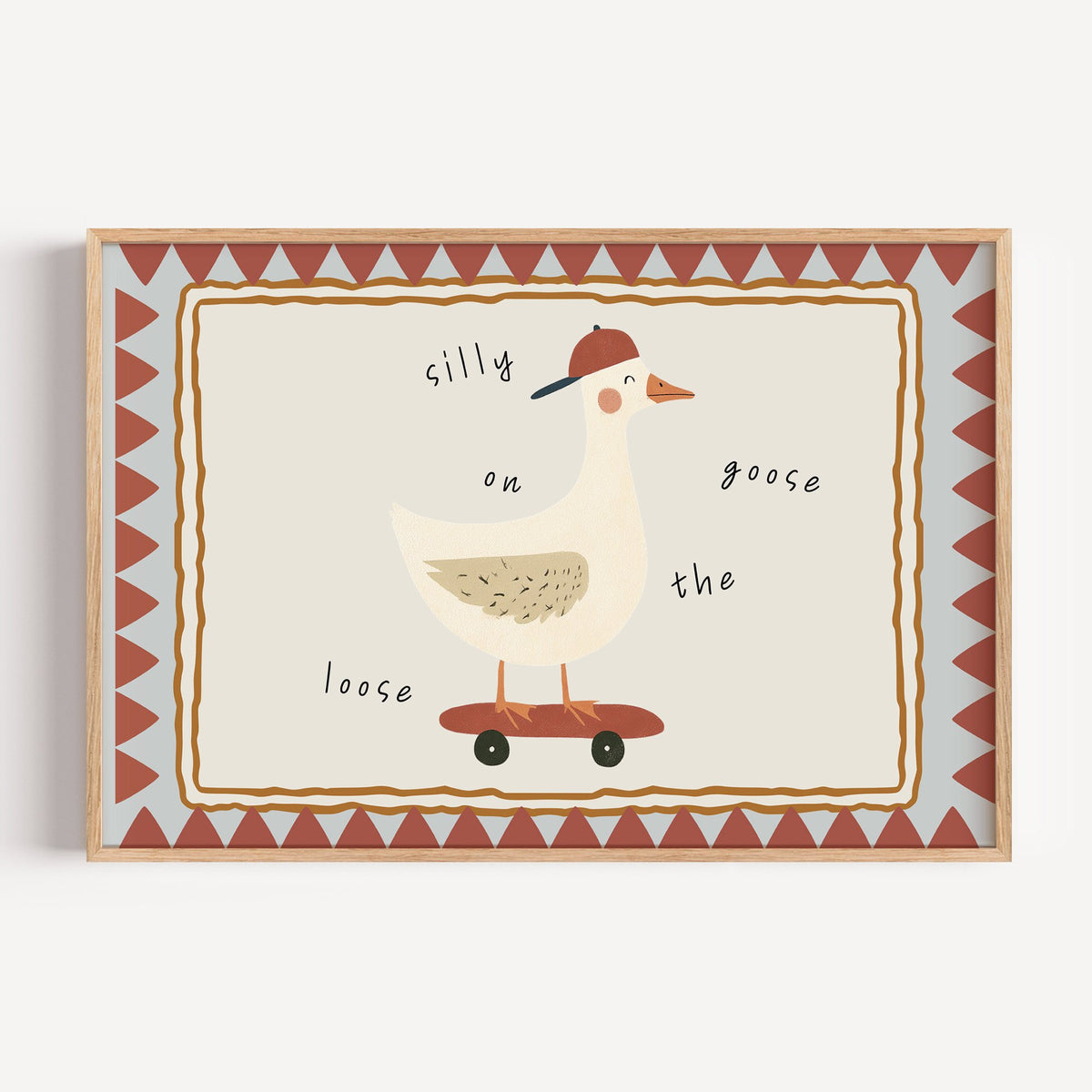 Landscape silly goose on the loose nursery print in a light oak frame on a plain white wall