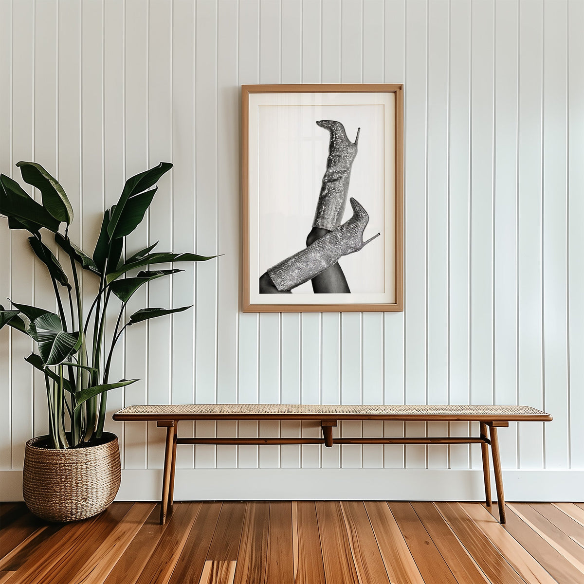 Silver sequin knee-high stiletto boots print in a wood frame with a white mat above a cane bench