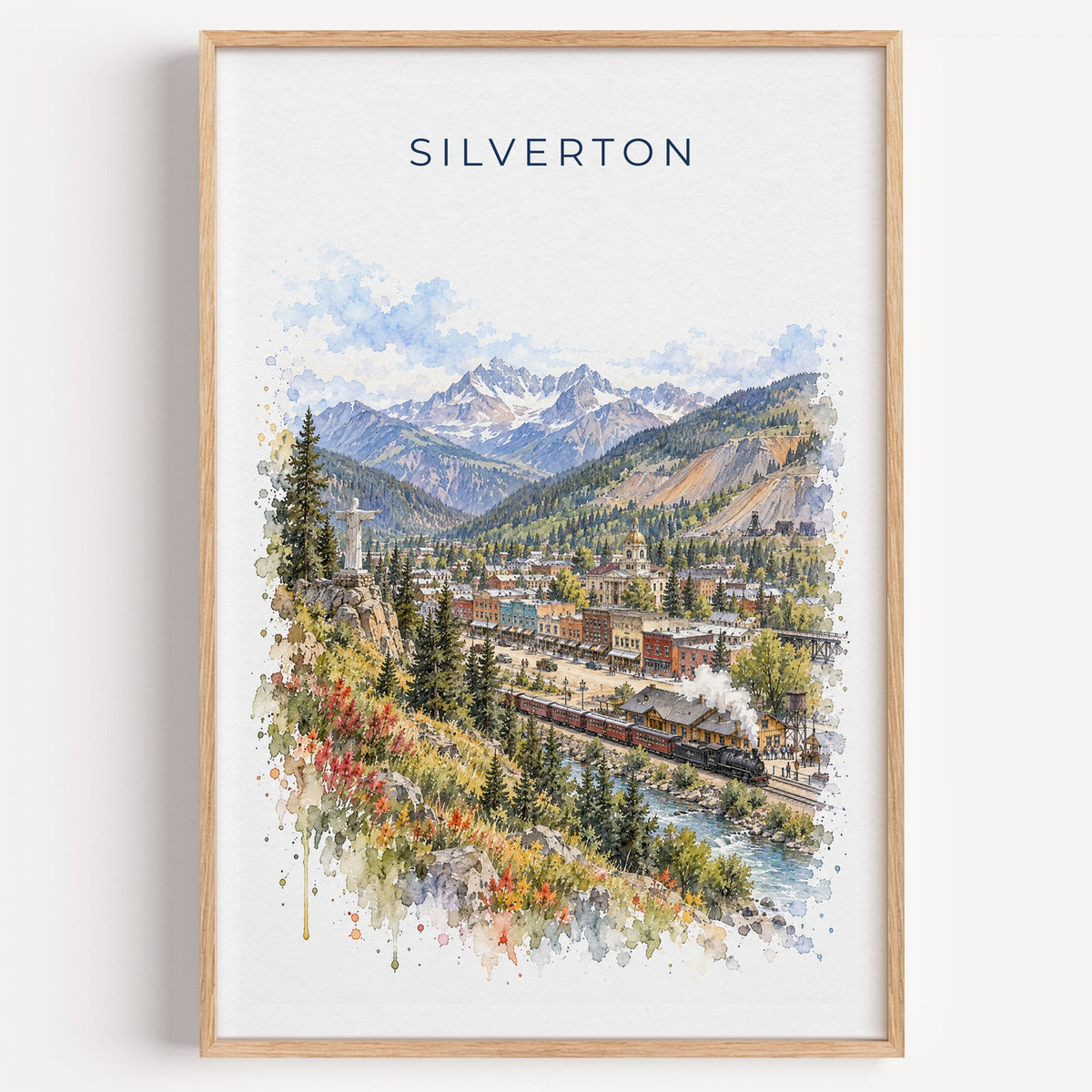 Silverton, Colorado watercolor print in a light oak frame on a plain white wall