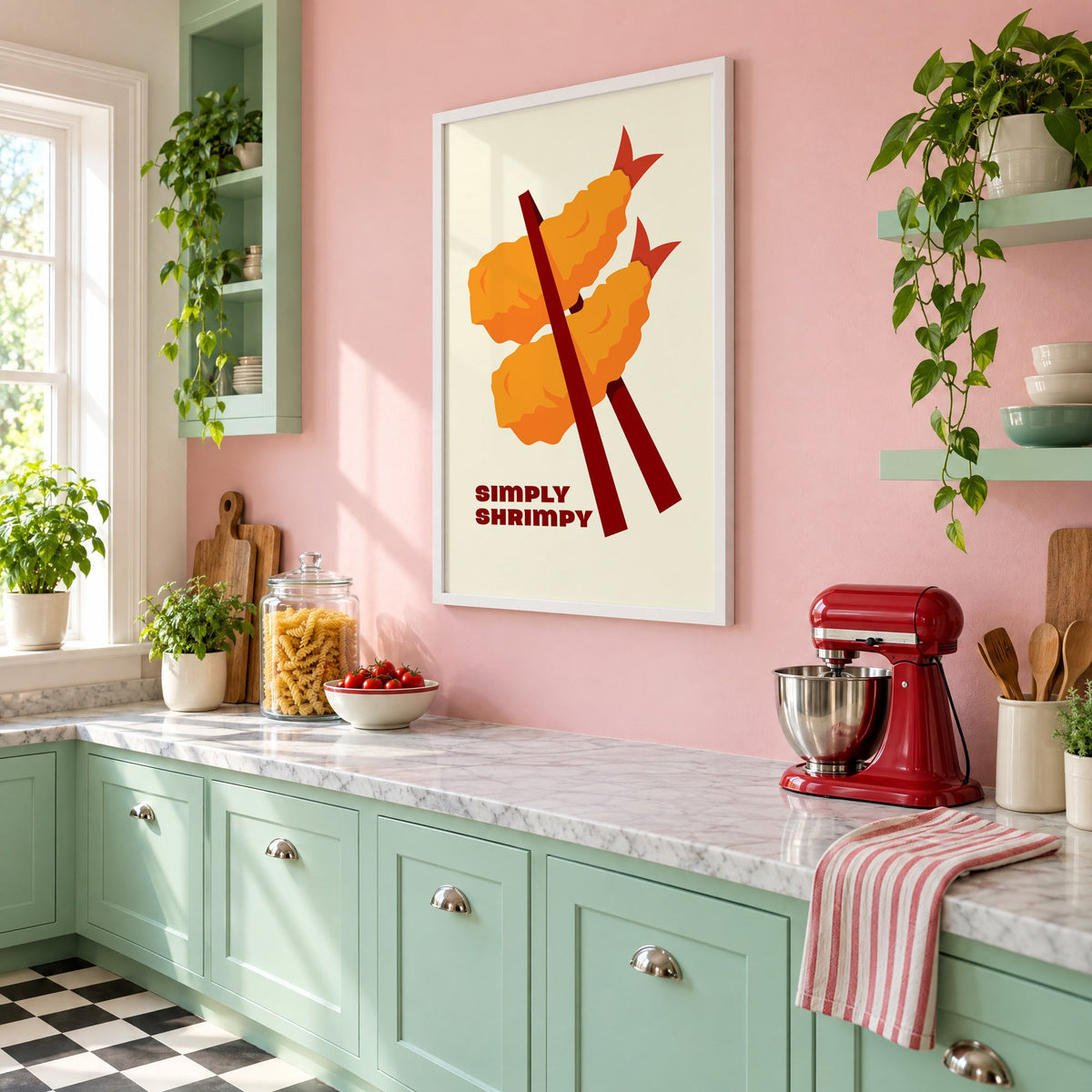 SIMPLY SHRIMPY tempura shrimp chopsticks print in a white frame on a pink wall above mint green cabinets in a retro kitchen, seen at an angle