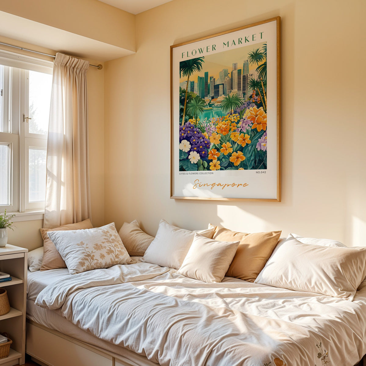 Singapore flower market print in an oak frame above a cream daybed in a sunny bedroom