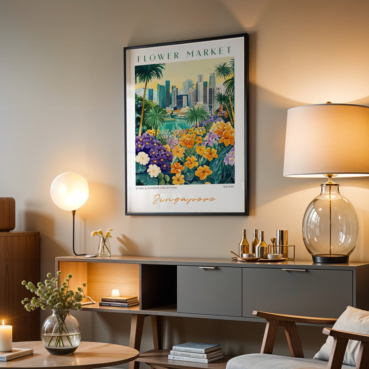 Singapore flower market print in a black frame above a grey media console with a glass table lamp