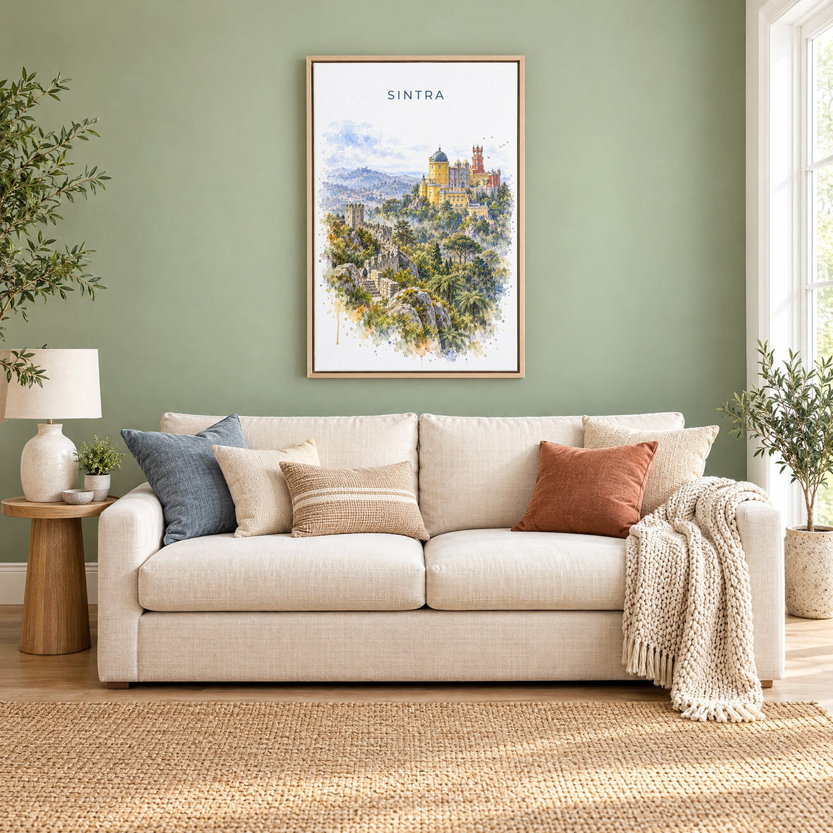 Sintra watercolor print as a natural floater canvas above a cream linen sofa on a sage green wall