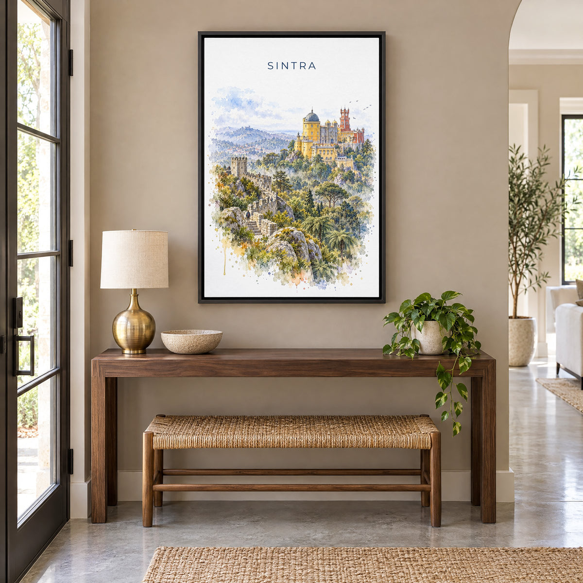Sintra watercolor print as a black floater canvas above a walnut console and woven bench in an entryway