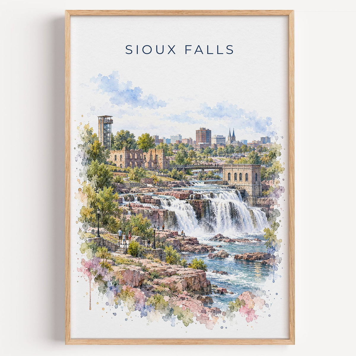 Sioux Falls watercolor print in a light oak frame on a plain white wall