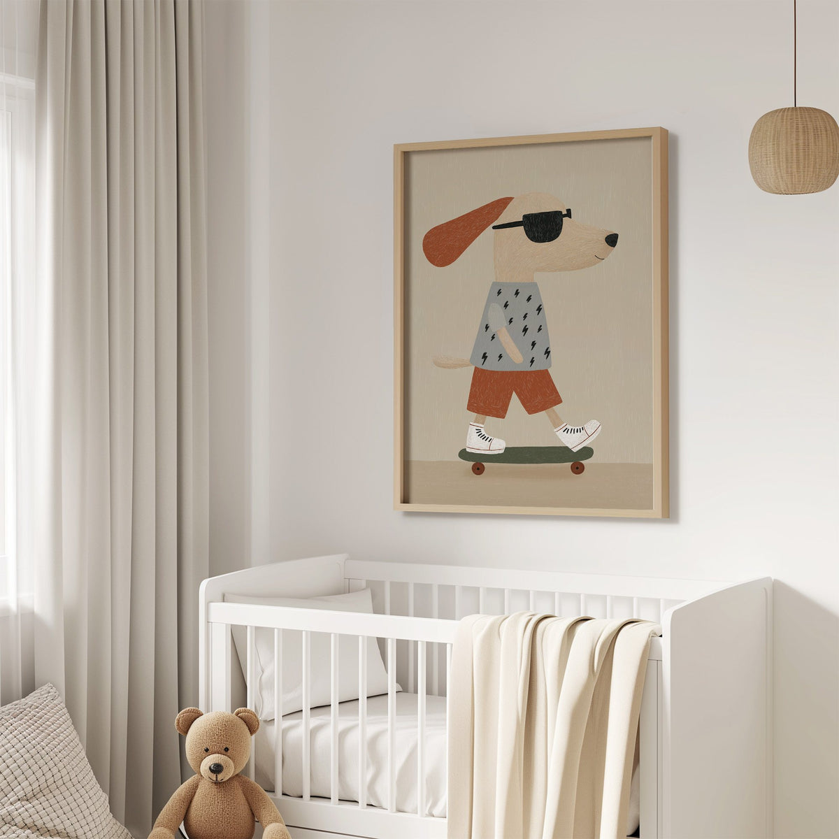 Skateboard dog lightning tee nursery print in an oak frame above a white crib with a teddy bear