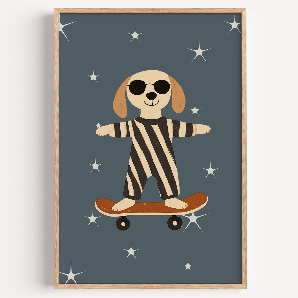 Skateboard dog starry night nursery print in a light oak frame on a plain white wall