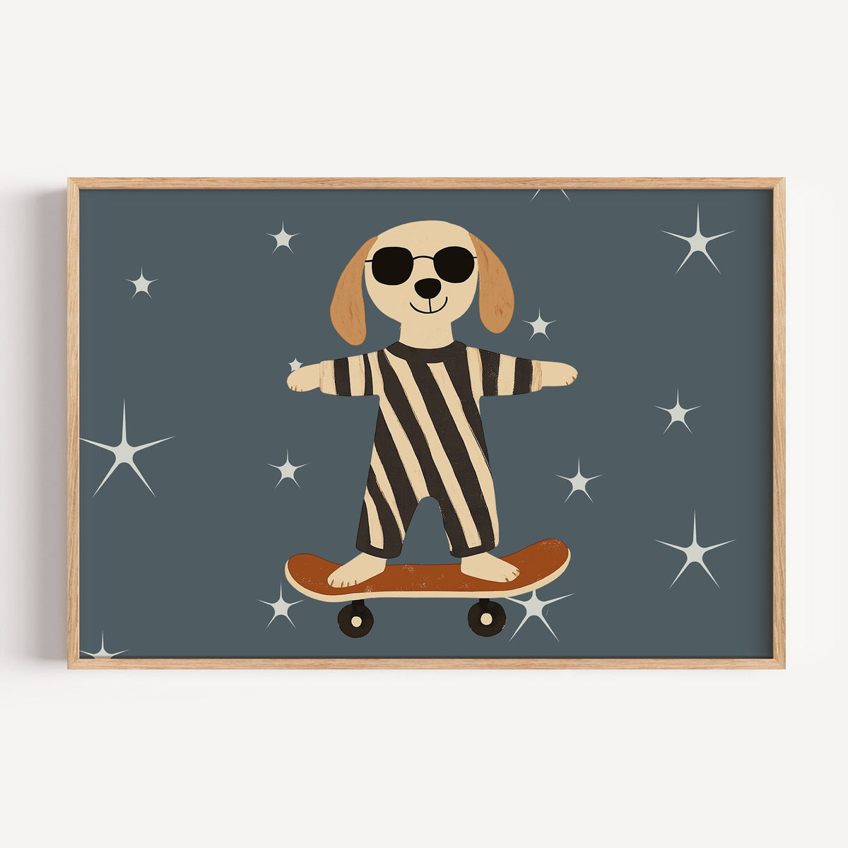 Landscape skateboard dog starry night nursery print in a light oak frame on a plain white wall