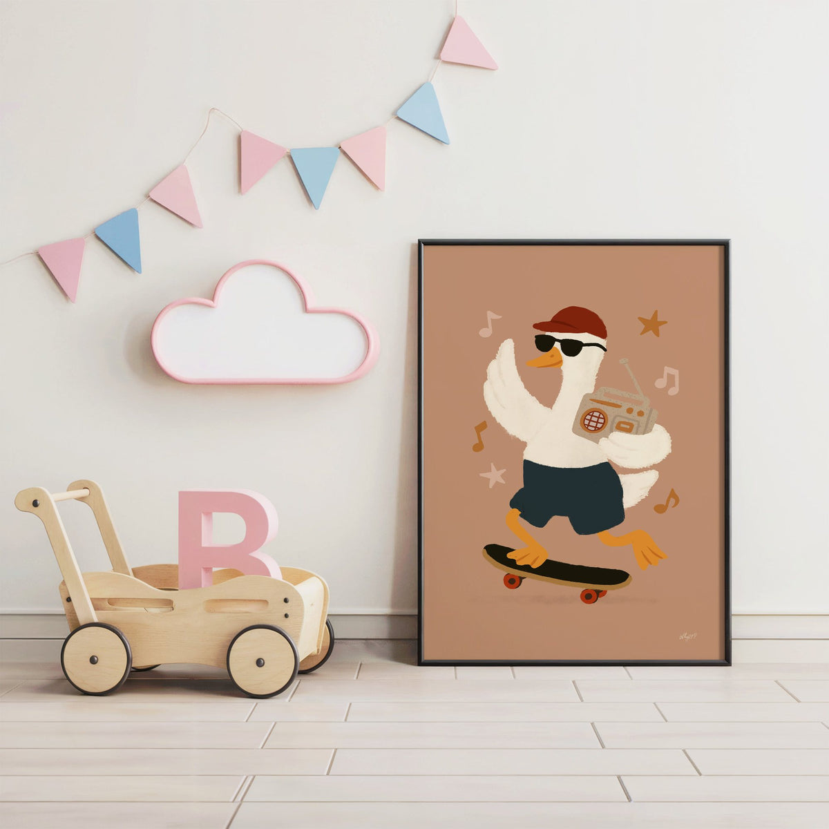 Goose on skateboard with boombox nursery print in a black frame under pastel bunting by a wooden baby walker