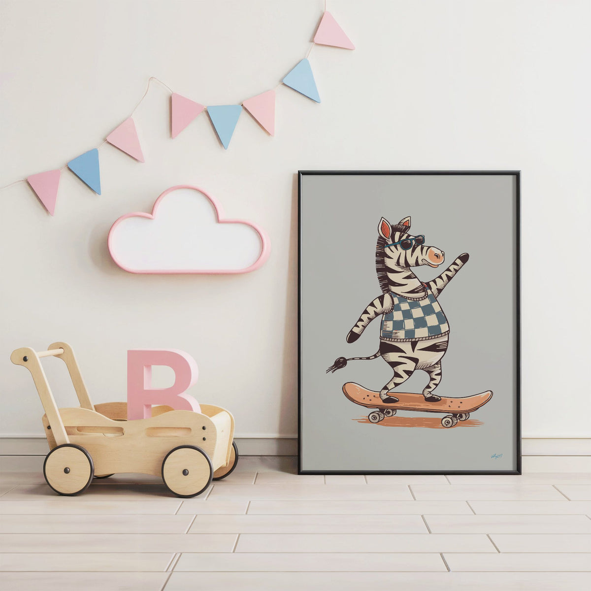 Zebra on orange skateboard nursery print in a black frame under pastel bunting by a wooden baby walker
