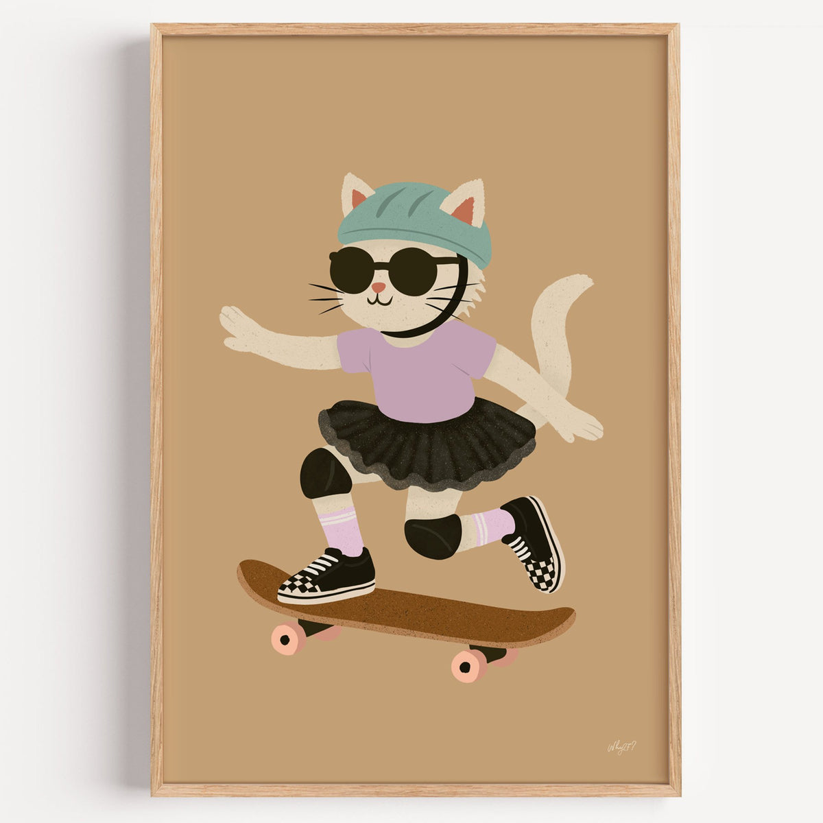 Skater cat in black tutu nursery print in a light oak frame on a plain white wall