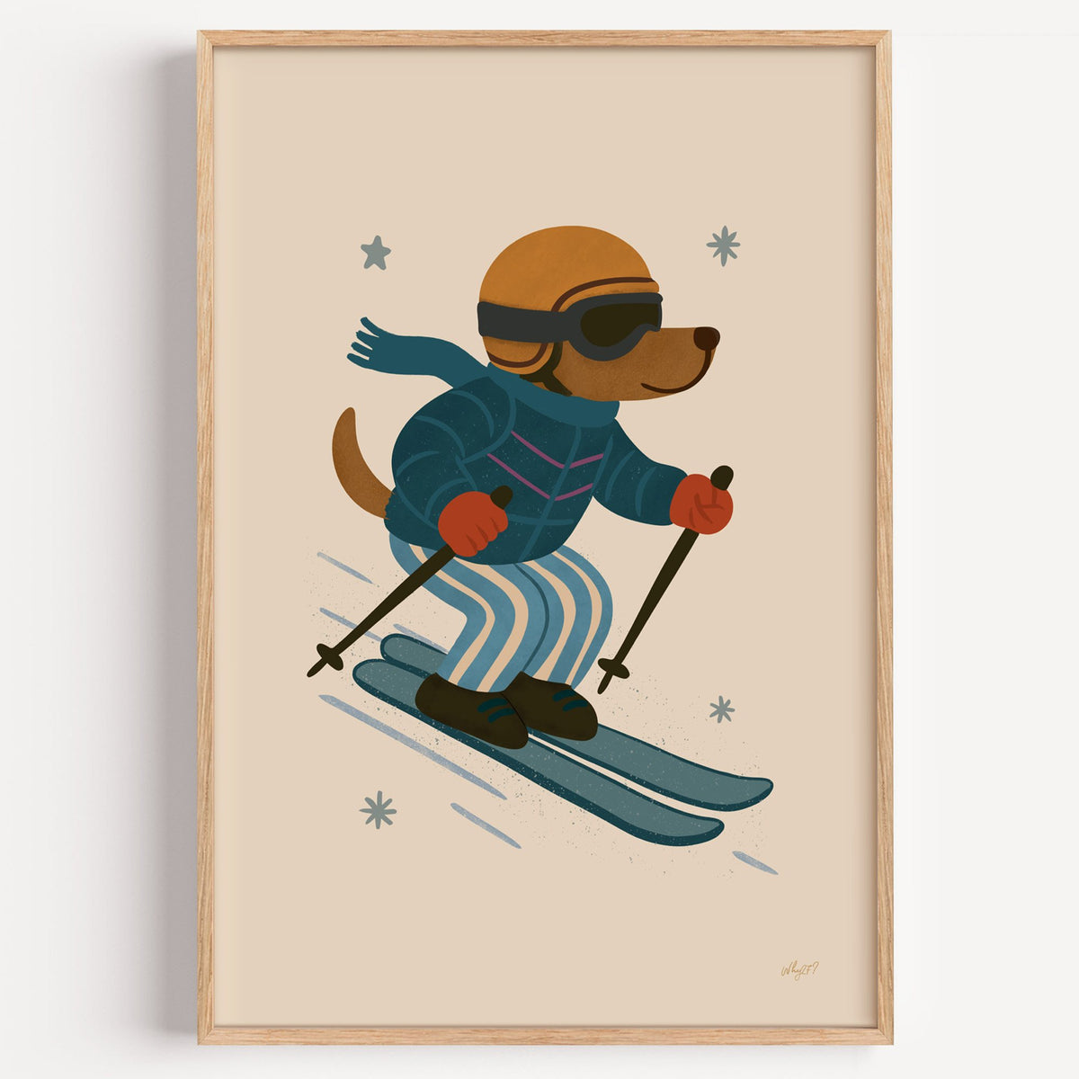 Skiing dog in puffer jacket nursery print in a light oak frame on a plain white wall