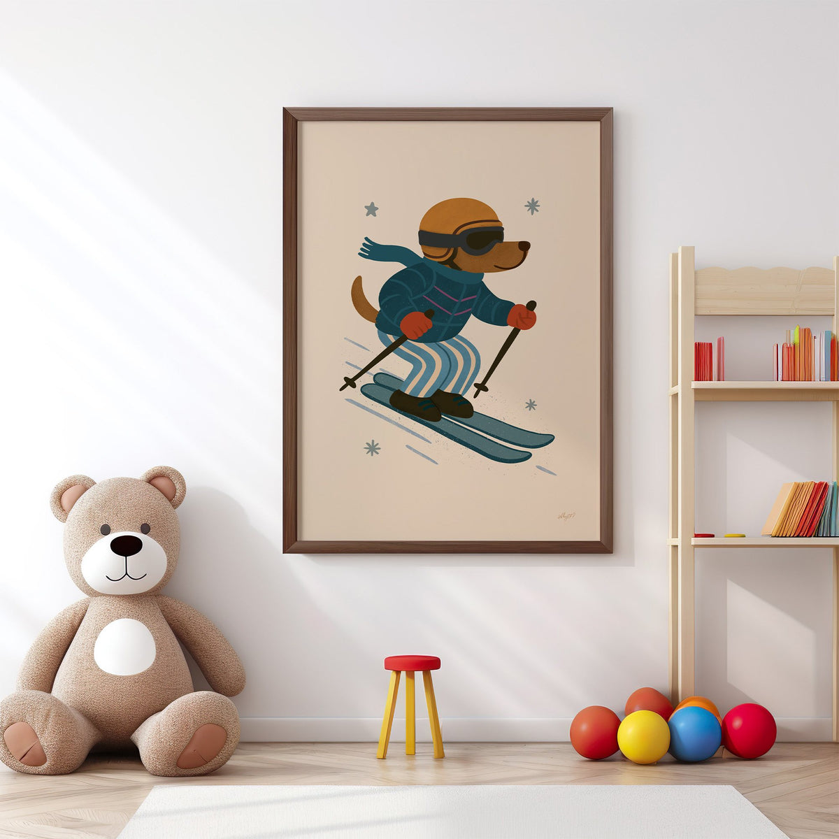 Skiing dog in puffer jacket nursery print in a walnut frame above a big teddy bear by a bookshelf