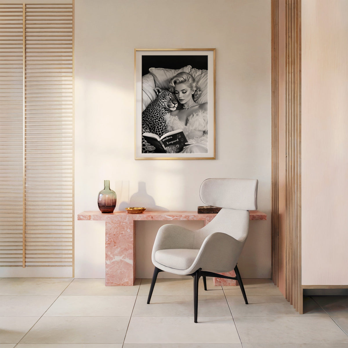 Woman asleep on pillows with leopard and book print shown in a gold frame above a pink marble console and armchair
