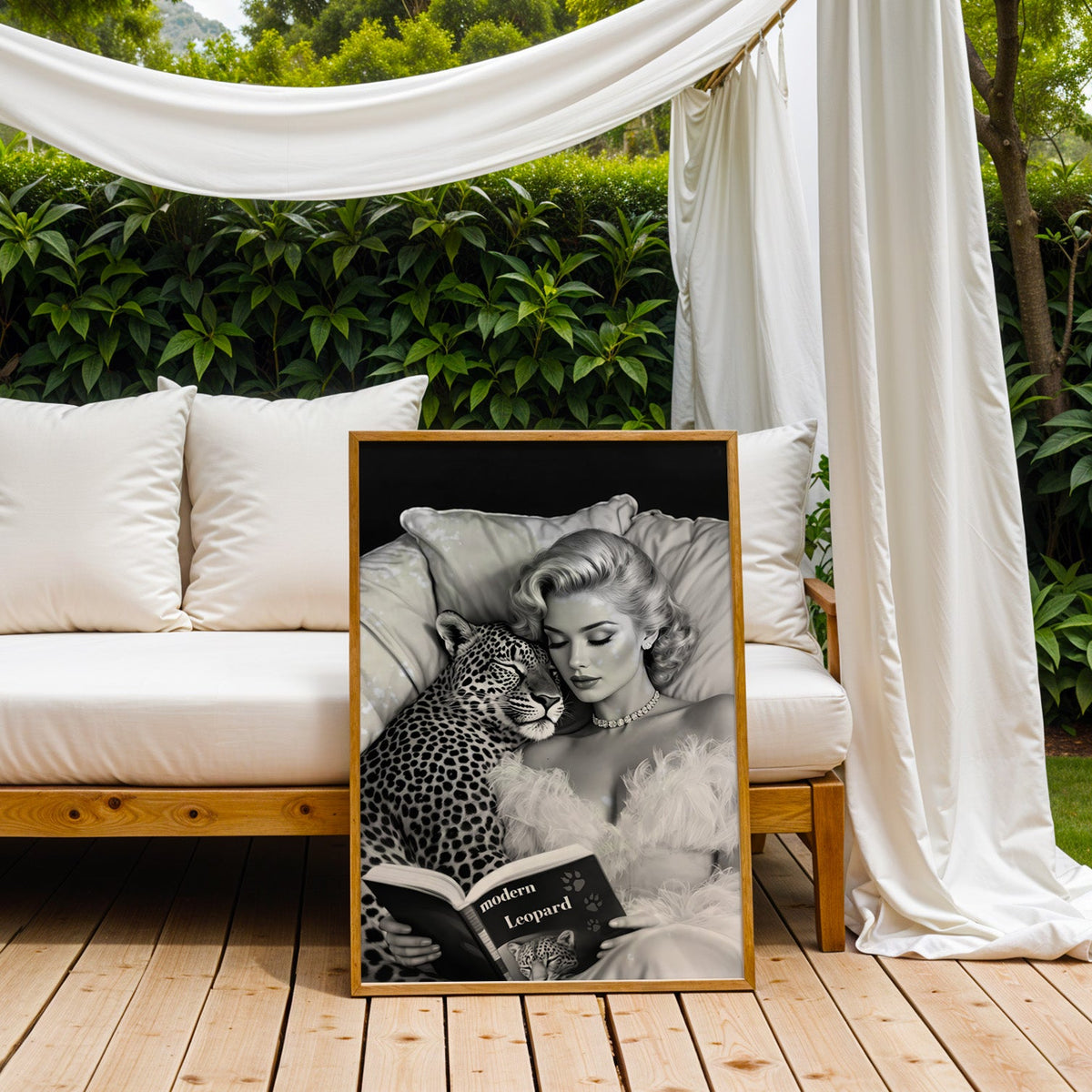 Woman asleep on pillows with leopard and book print in an oak frame on an outdoor daybed under white drapes