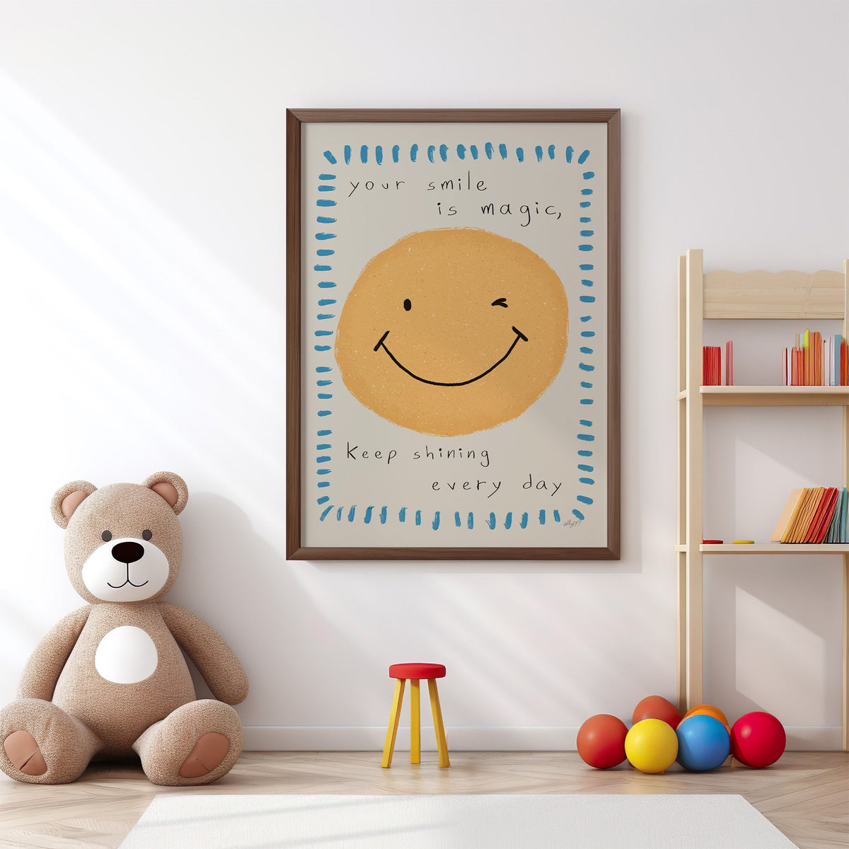Winking smiley face quote nursery print in a walnut frame above a big teddy bear by a bookshelf