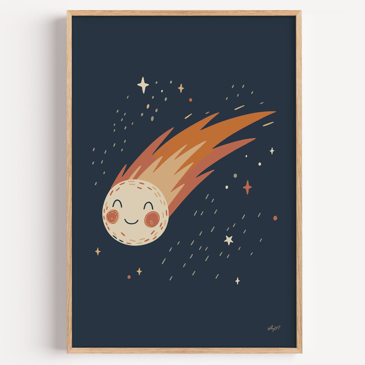 Smiling comet with fiery tail nursery print in a light oak frame on a plain white wall