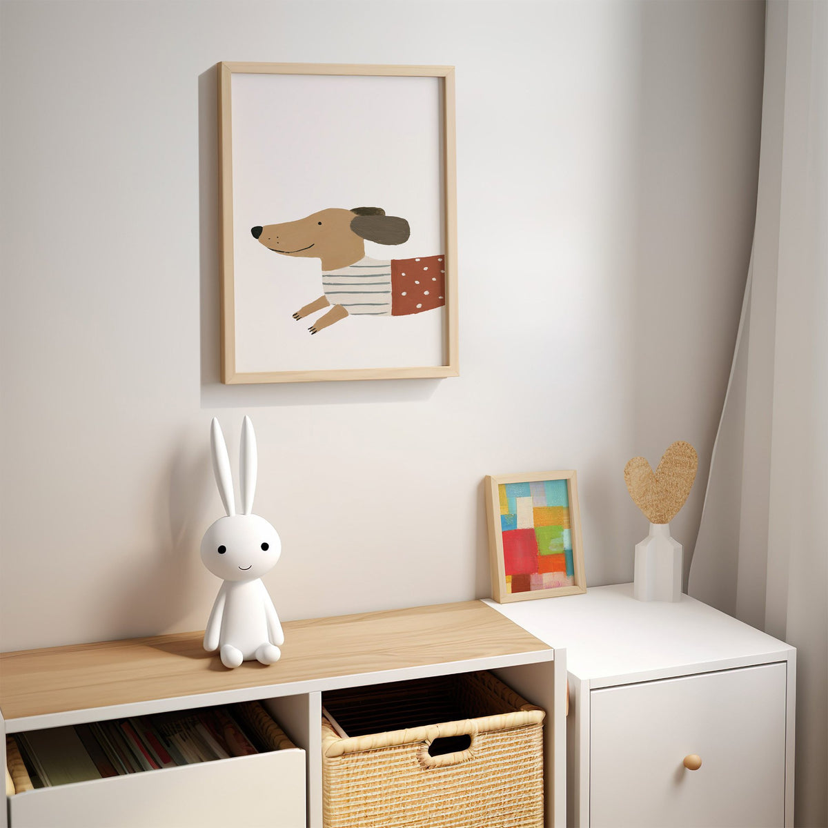 Smiling dachshund close-up nursery print in an oak frame above a kids cubby shelf with a woven basket and bunny lamp