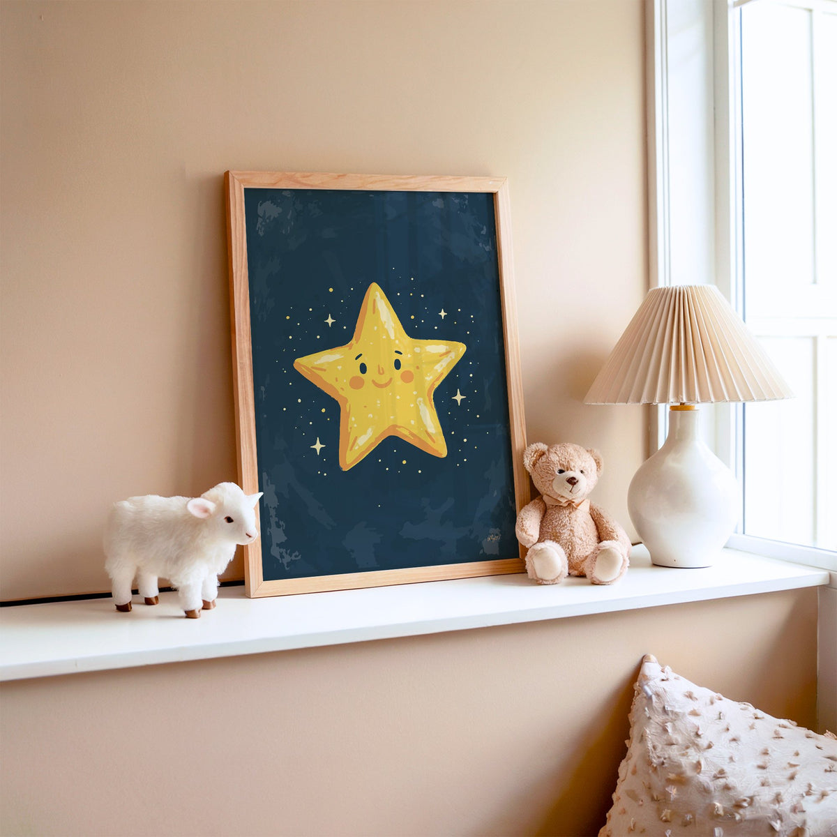 Smiling yellow star on navy nursery print in an oak frame on a window ledge with a toy lamb and teddy