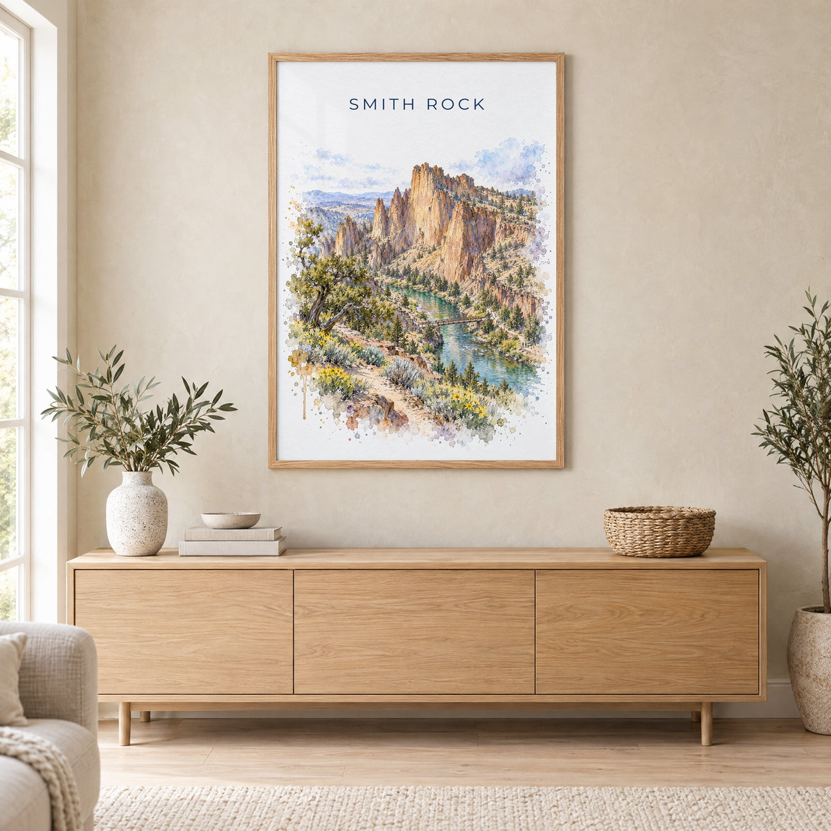 Smith Rock watercolor print in an oak frame above a light wood sideboard in a Scandinavian living room