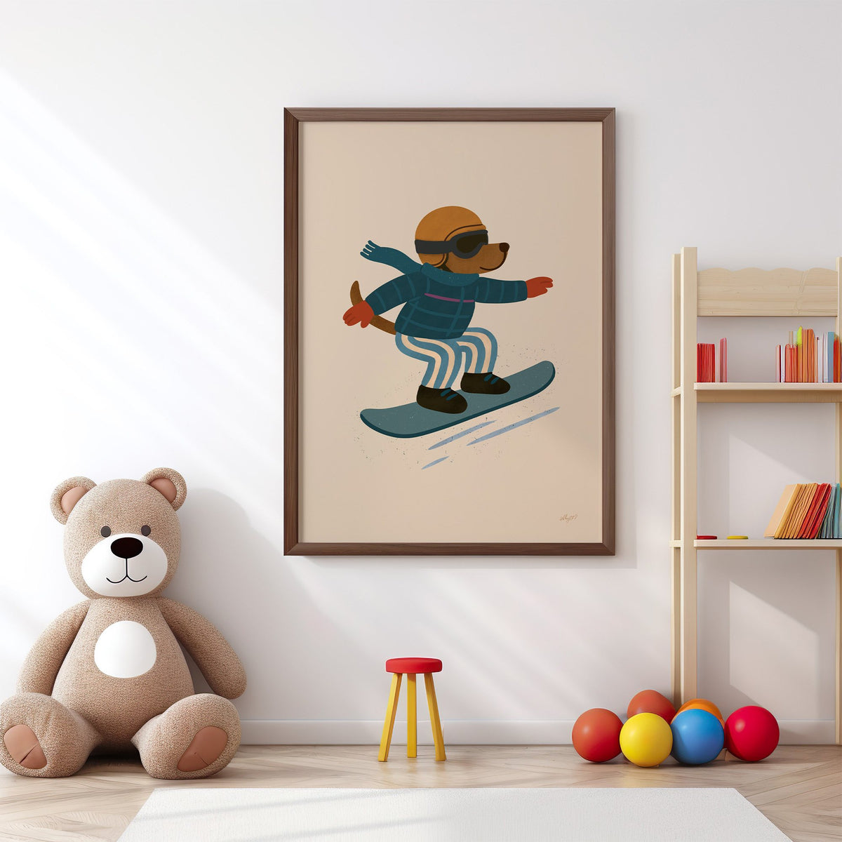 Snowboarding dog with arms wide nursery print in a walnut frame above a big teddy bear by a bookshelf