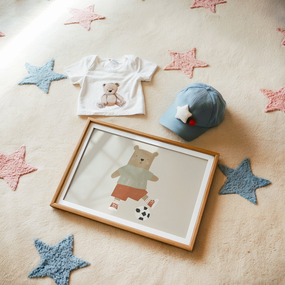 Landscape soccer bear orange shorts nursery print in a matted oak frame on a star rug with a baby tee