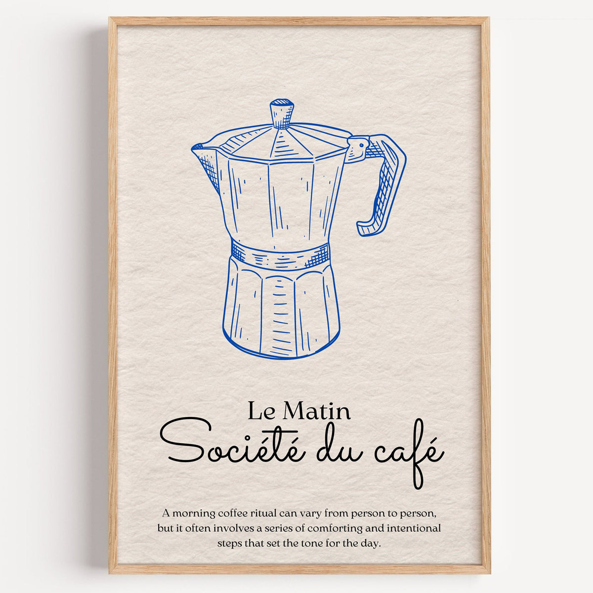 Societe du cafe cobalt moka pot print in a light oak frame on a plain white wall