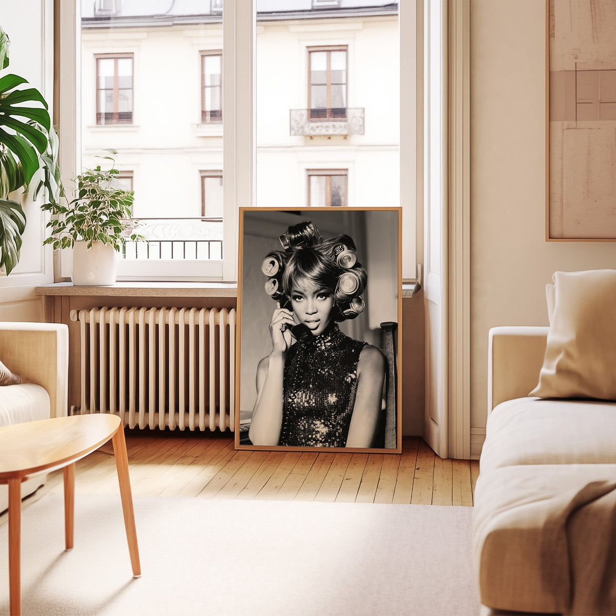 Woman with soda can hair rollers on telephone print in an oak frame leaning by a French window in a living room