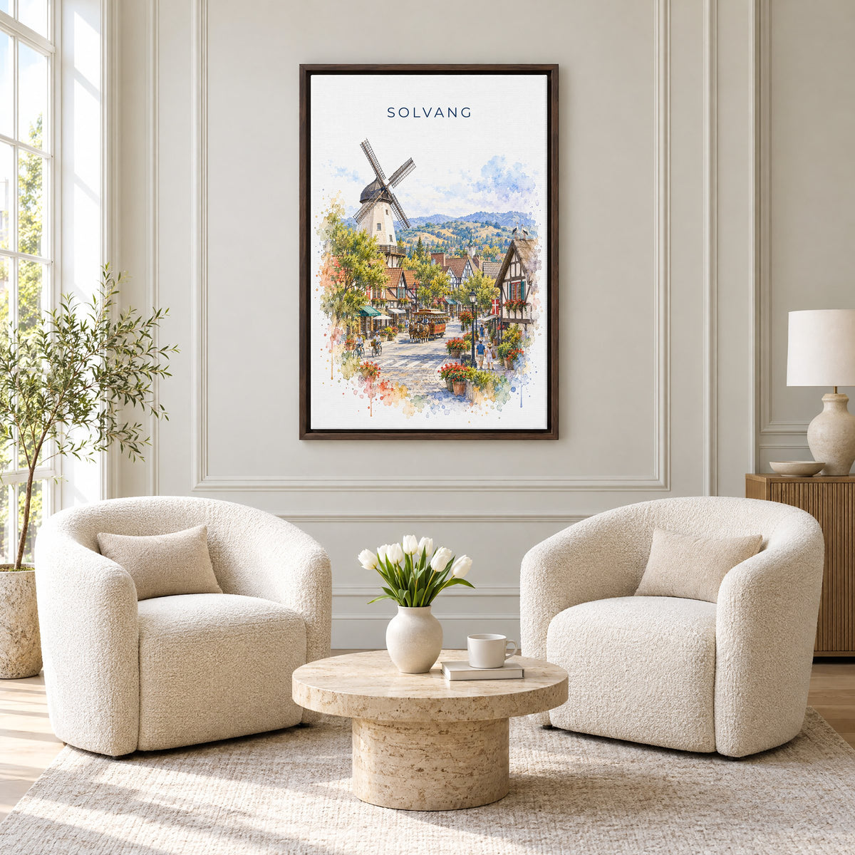 Solvang watercolor print as an espresso floater canvas above two boucle armchairs in a hotel lounge
